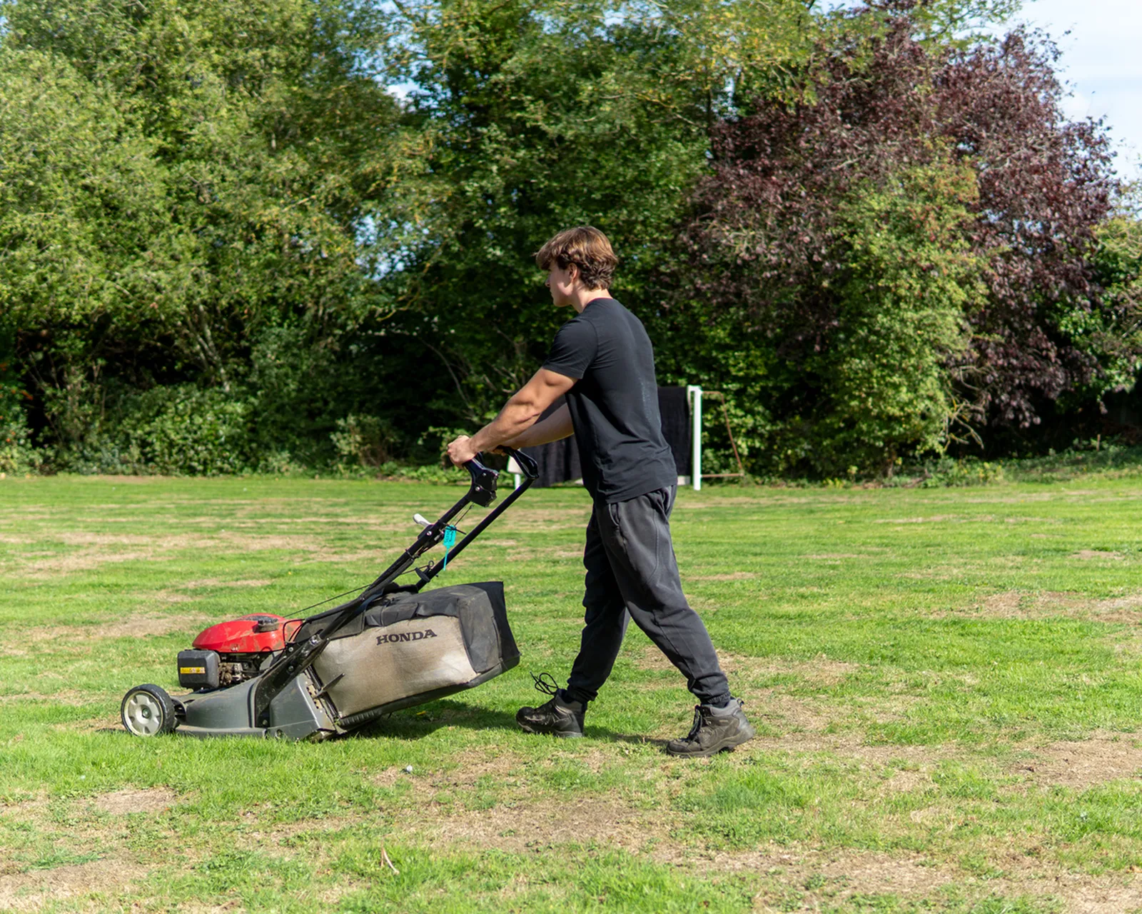 Gardener Mowing Lawn