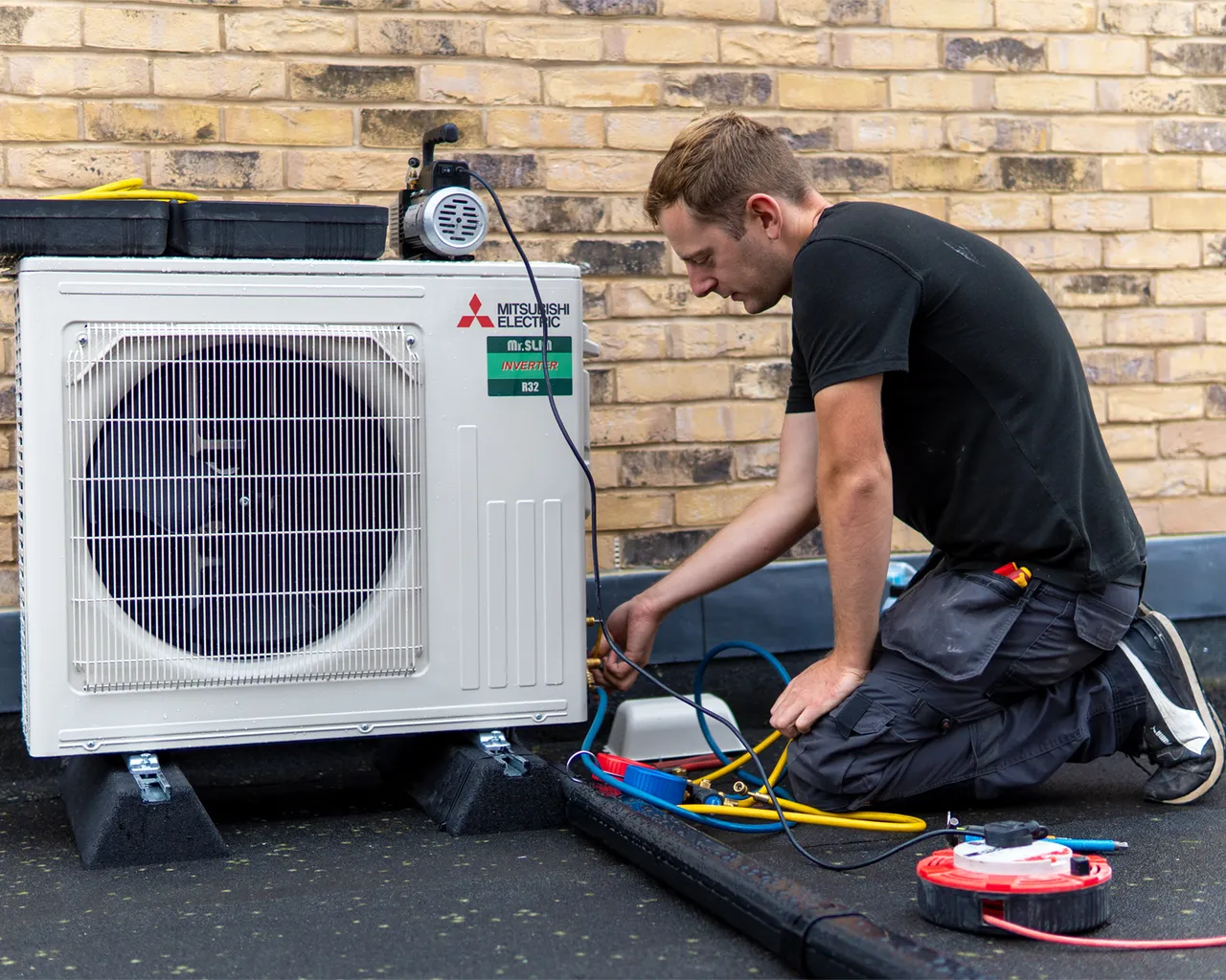 Aircon Technician On Roof