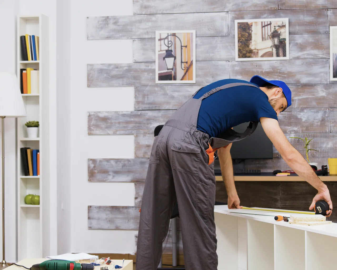 Guy Building Flatpack Shelving Unit