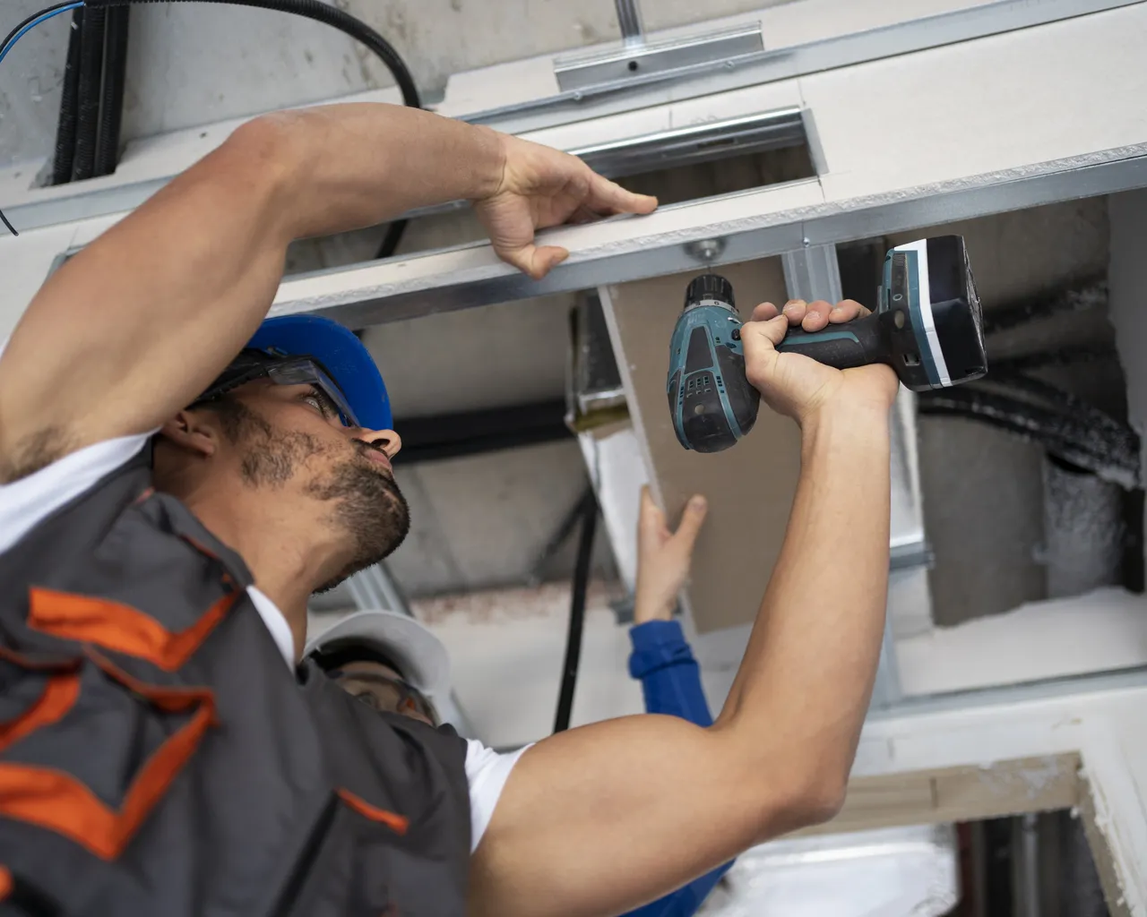Low Angle People Working With Drill