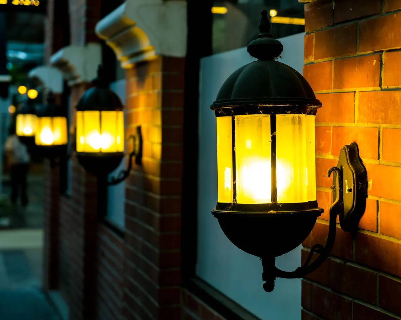 Lamp Against Red Brick Wall Night