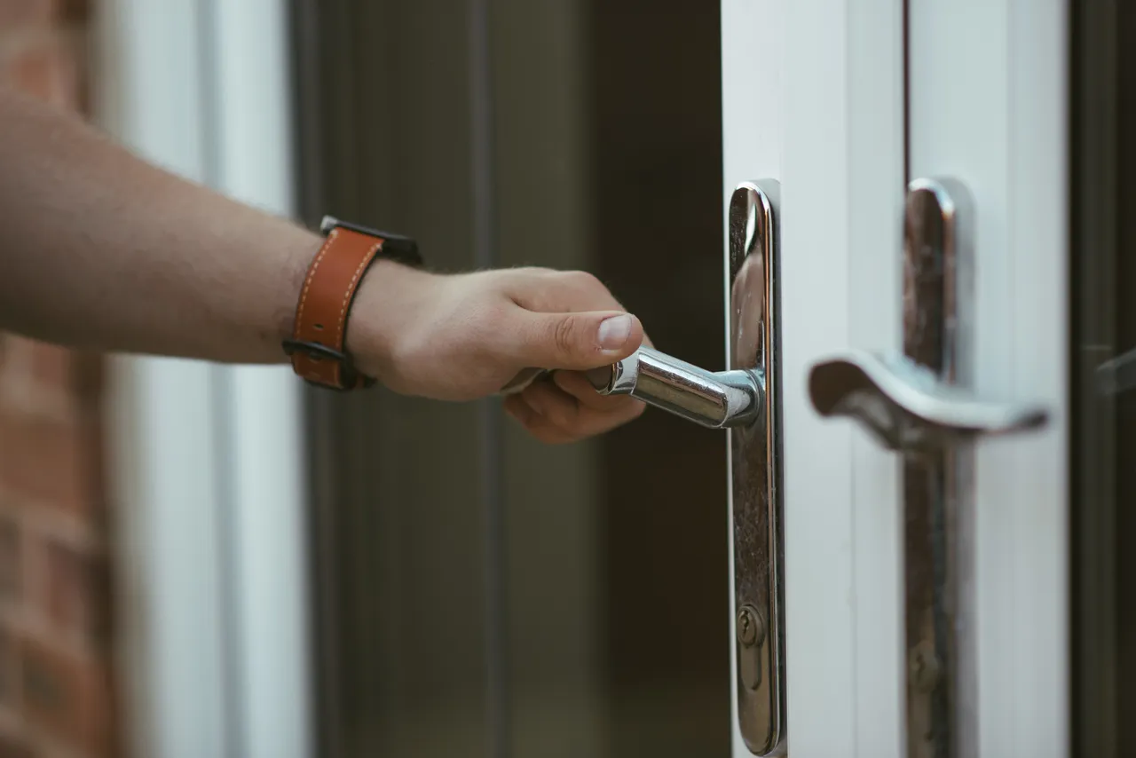Closeup Shot Person Holding Door Knob Opening Door