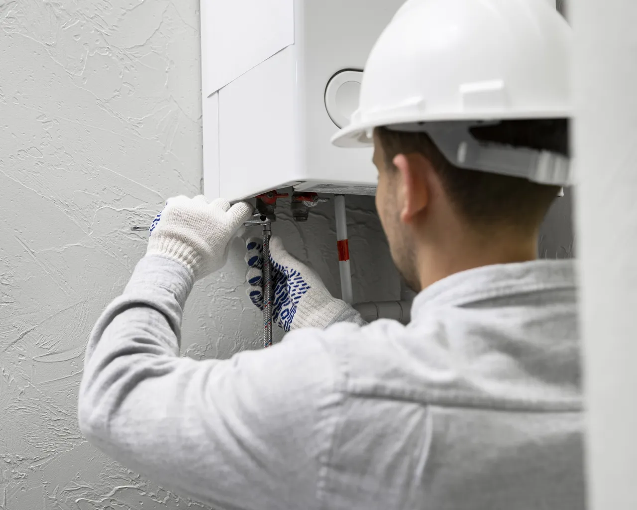 Worker Repairing Water Heater