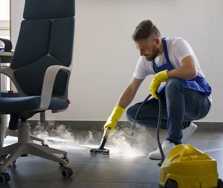 Professional Cleaning Service Person Using Steam Cleaner Office