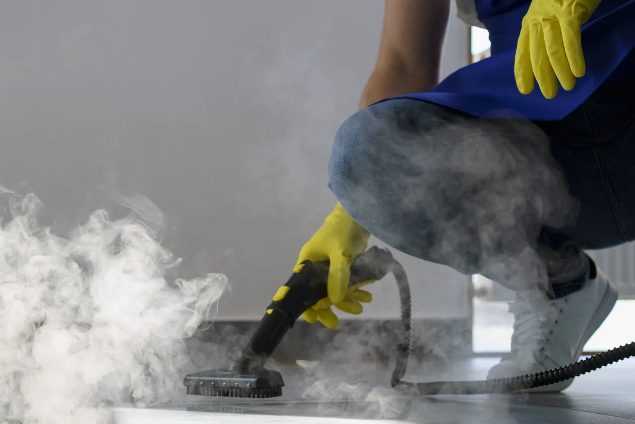 Professional Cleaning Service Person Using Steam Cleaner